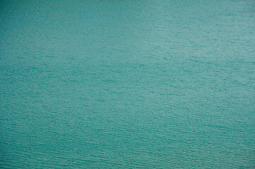 Full frame turquoise lake water as a backdrop.