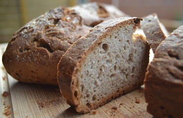 loaf of homemade rye bread on a wooden board
