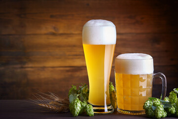 Glasses of beer on a wooden table. Oktoberfest