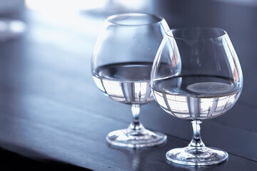 glass of water with ice in the restaurant / cold clear clear water in a glass with ice pieces