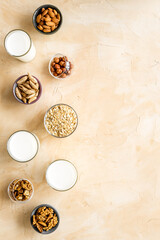 Obraz na płótnie Canvas Vegan non-diary milk. Alternative types of milk with nuts and oat