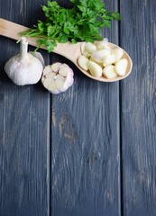 Harvest garlic on wooden dark background