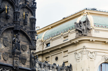 Fototapeta na wymiar Architectural detail of Powder Tower statues and surrounding buildings, Prague, Czech Republic