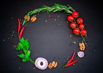 Round food frame with chilli, parsley, cherry tomatoes, spices with copy space