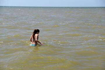 the girl goes into the sea