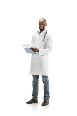 Paperwork. African-american doctor isolated on white background, professional occupation. Daily hard work for health and lives saving. Full length portrait. Medicine, healthcare, profession concept.