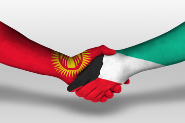 Handshake between kuwait and kyrgyzstan flags painted on hands, illustration with clipping path.