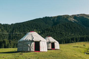 Asian yurts on a hill in the Kyrgyzstan Jeti Oguz Valley