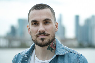 Portrait of young adult male in city