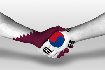 Handshake between south korea and qatar flags painted on hands, illustration with clipping path.