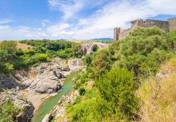 Obraz premium Vulci (Italy) - Etruscan ruins city in Lazio region, on the Fiora river and Maramma countryside, with archeological site and medieval castle, now museum.
