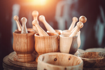 Group of  wooden mortar and pestle with bowls on the countertop at antique bazaar. Shopping at sunday flea market.