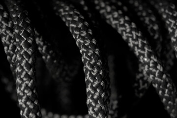 Black twisted rope on a black background