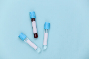 Blood test. Test tubes on blue background. Top view