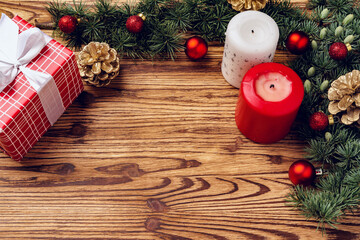Christmas background with decorations on brown wooden board