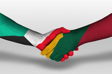 Handshake between lithuania and kuwait flags painted on hands, illustration with clipping path.