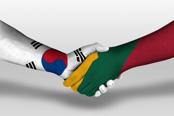 Handshake between lithuania and south korea flags painted on hands, illustration with clipping path.