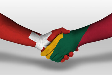 Handshake between lithuania and switzerland flags painted on hands, illustration with clipping path.