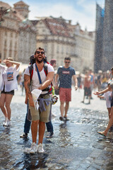 Fototapeta na wymiar Man with a backpack traveling and enjoying summer at raining day.