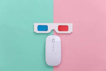 PC mouse and anaglyph 3D glasses on pink blue pastel background. Top view. Minimalism