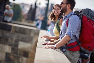 Man and woman in love traveling and exploring old town together.
