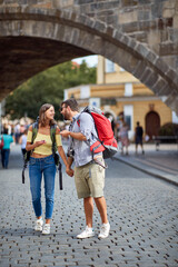 Obraz premium Couple in love walking in the streets of Prague.Travel, tourism and people concept.