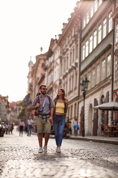 Walking at vacation at Europe. Man and woman traveling together smiling and enjoying at summer vacation..