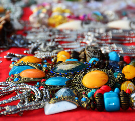 Silver brass necklace decorated with yellow, red, blue stone beads and multi-colored gems is a beautiful jewelry.