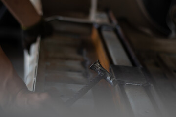 Worker,welding in a car factory with sparks, manufacturing, industry