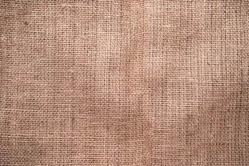 Plakat A top view of natural hessian material texture background fabric.