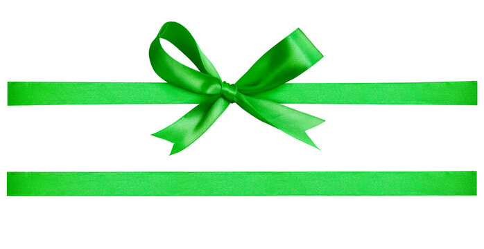 A green ribbon and bow Christmas, birthday and valentines day present decoration set isolated against a white background