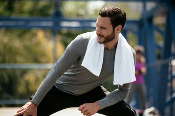 A young man streching before a run