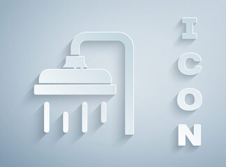 Paper cut Shower head with water drops flowing icon isolated on grey background. Paper art style. Vector Illustration.