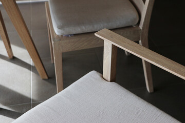 Detail of teak wood furniture, Closeup dining chair on the floor