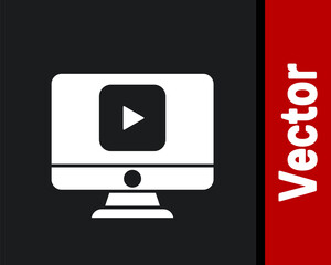 White Online play video icon isolated on black background. Computer monitor and film strip with play sign. Vector Illustration.