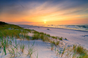 Beautiful summer sunset over beach at Baltic sea