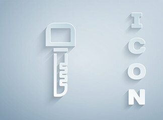 Paper cut Key icon isolated on grey background. Paper art style. Vector Illustration.
