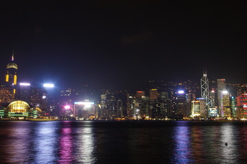 Fototapeta na wymiar City landscape. Victoria Harbor and Hong Kong skyscrapers at night.