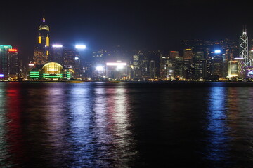 Obraz premium City landscape. Victoria Harbor and Hong Kong skyscrapers at night.