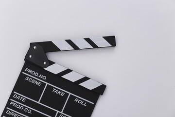 Fototapeta na wymiar Movie clapper board on white background. Filmmaking, Movie production, Entertainment industry. Top view