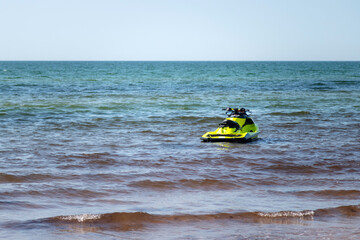 Fototapeta na wymiar Water jet ski at the blue sea shore on a sunny day with copy space for text. Nobody.