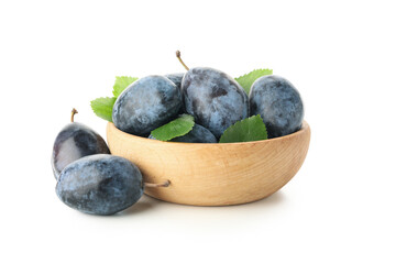 Bowl with plums isolated on white background