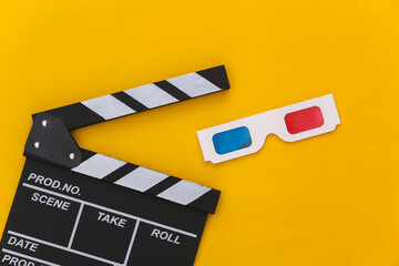 Fototapeta na wymiar Movie clapper board with 3d glasses on yellow background. Cinema, Filmmaking, Movie production, Entertainment industry. Top view