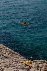 A canoe kayak boat on the sea and crystal clear waters