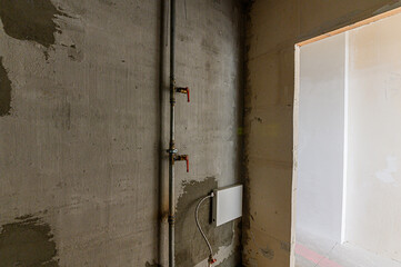 Russia, Moscow- February 15, 2020: interior room rough repair for self-finishing. interior decoration, bare walls of the premises, stage of construction