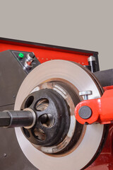 The brake disc is already machined on the machine. Car repair.