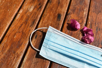 Mask face on wooden background
