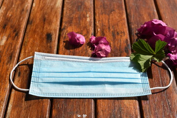 Mask face on wooden background