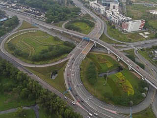 Clover at Skudai Highway with a park at a busy traffic intersection