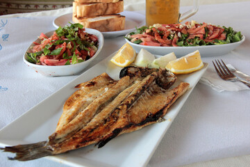 delicious fish and salads on presentation plate